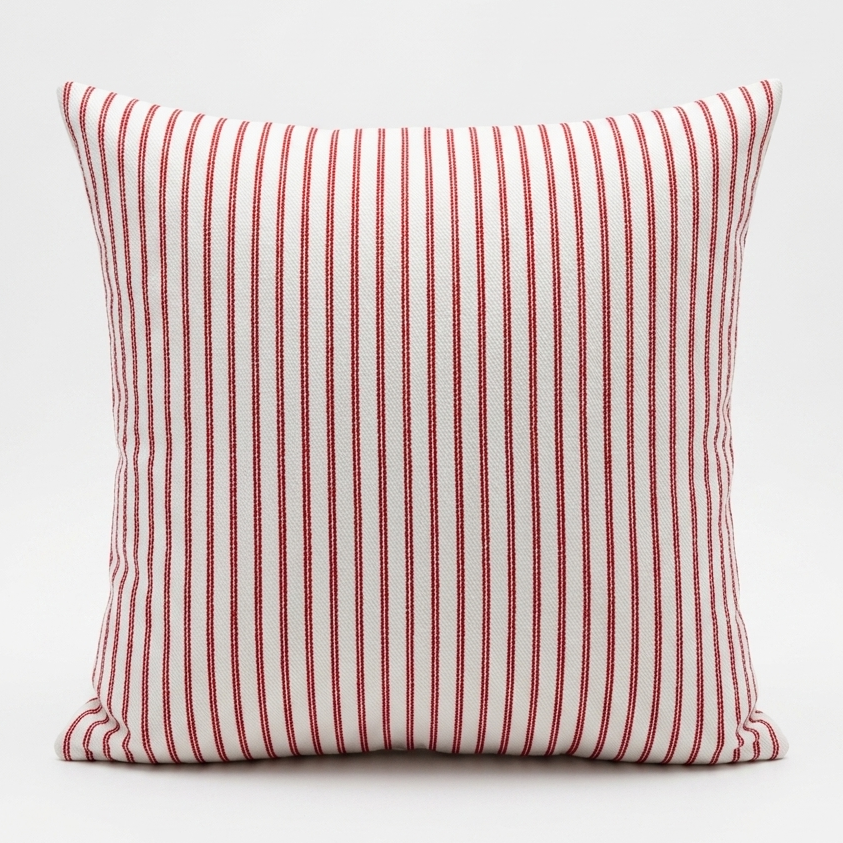 A square throw pillow with vertical red stripes on a white background, photographed against a clean white studio backdrop. Pillow cover has a zipper and cover can be removed and washed. Insert sold separately. 