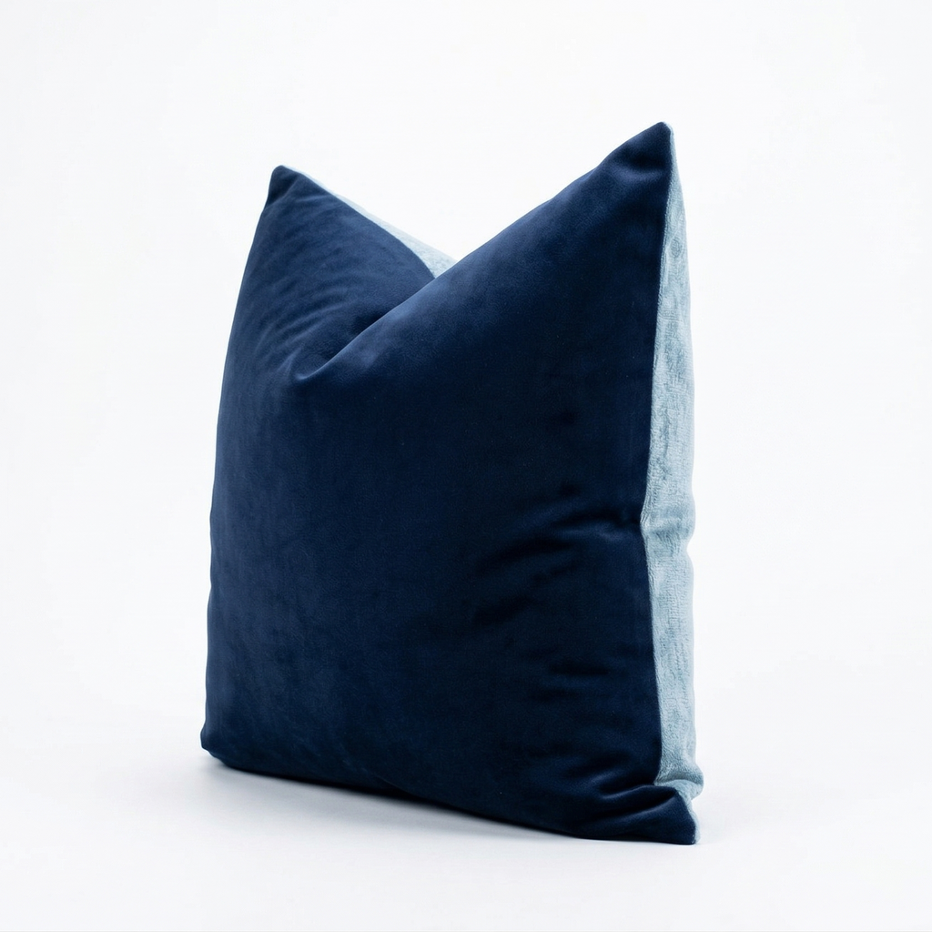 Navy blue velvet pillow on a white background