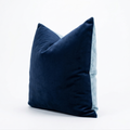 Navy blue velvet pillow on a white background