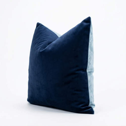 Navy blue velvet pillow on a white background
