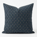 A square throw pillow in dark blue denim-like fabric with a small beige cross pattern, shown against a plain white background. Pillow cover has a zipper to remove the case and wash. Insert sold separately. 