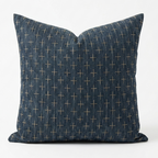 A square throw pillow in dark blue denim-like fabric with a small beige cross pattern, shown against a plain white background. Pillow cover has a zipper to remove the case and wash. Insert sold separately. 