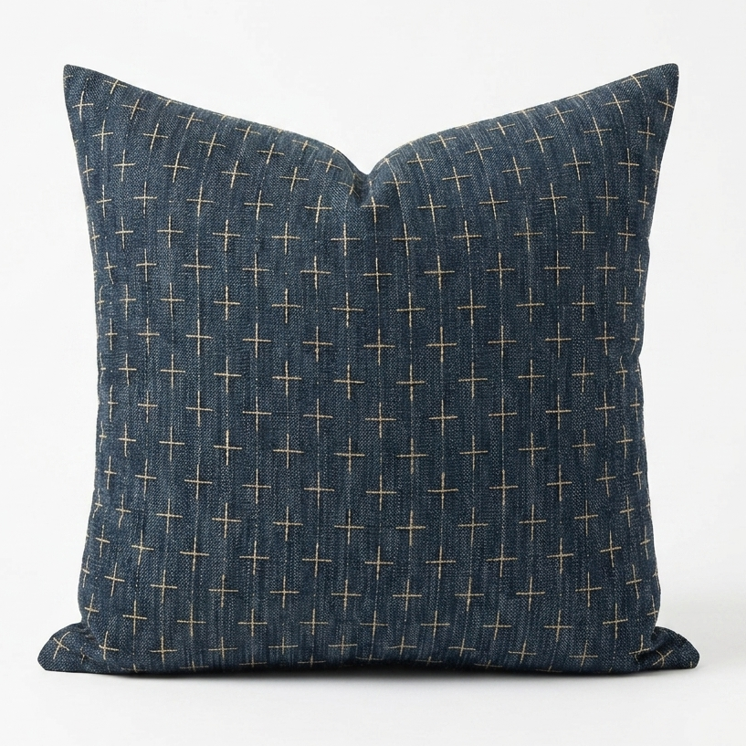 A square throw pillow in dark blue denim-like fabric with a small beige cross pattern, shown against a plain white background. Pillow cover has a zipper to remove the case and wash. Insert sold separately. 