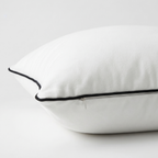 White velvet pillow with black trim. Pillow cover is removable with featured side zipper.
