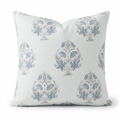 Decorative pillow with blue floral patterns on a white background