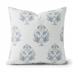 Decorative pillow with blue floral patterns on a white background