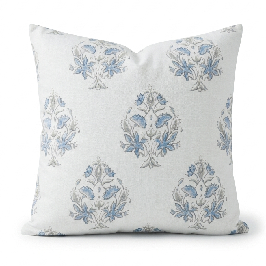 Decorative pillow with blue floral patterns on a white background