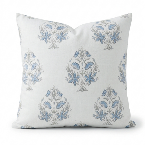 Decorative pillow with blue floral patterns on a white background