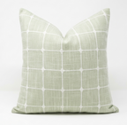 Throw pillow green with white grid pattern. Pillow features removable cover.