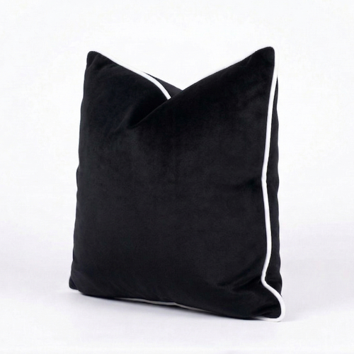 Black velvet throw pillow cover with white trim on a white background