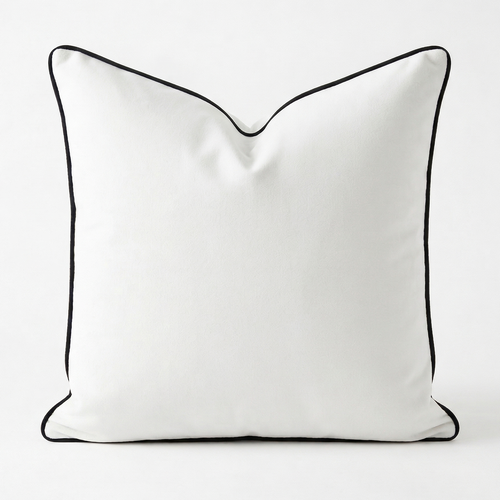 White velvet removable pillow cover with black piping on a white background