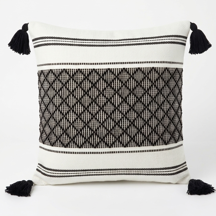 Decorative pillow with black and white pattern and tassels. Removable throw pillow cover 20 x 20.