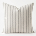 White linen, decorative, removable pillow cover with grey stripes.