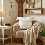 Cozy living room with a plush armchair, side table, and white textured throw pillow. Throw pillow features removable cover for easy washing.