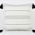 White decorative pillow cover with cream and black stripes and black tassels. Removable throw pillow cover for easy swapping and washing.